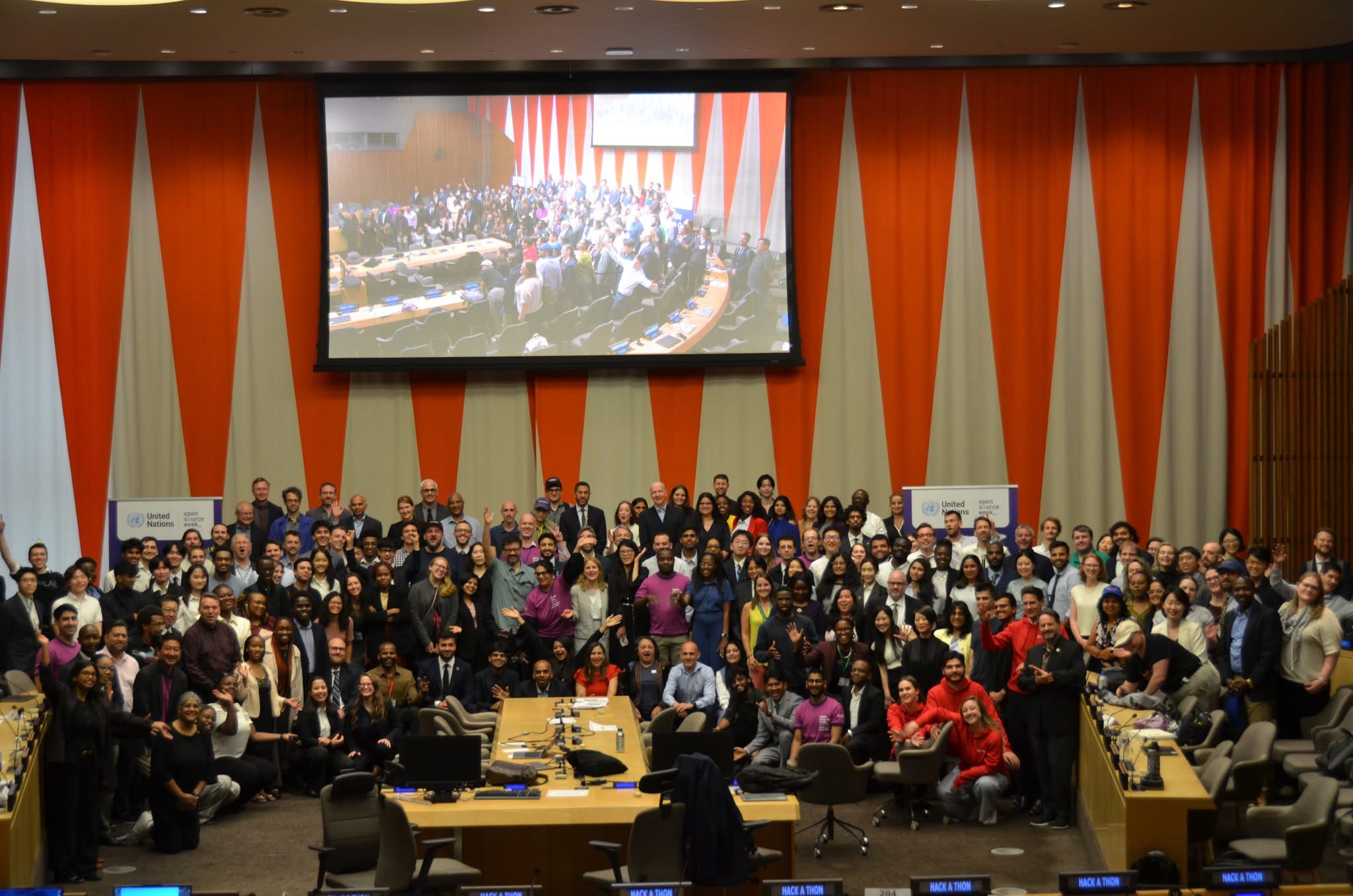 Group photo of UN Open Source Week participants in a UN conference room